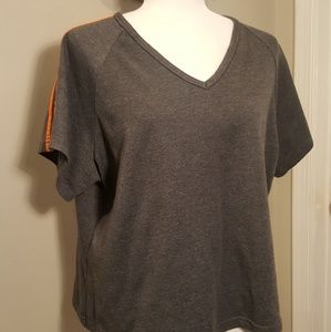Grey short sleeved top with orange stripes